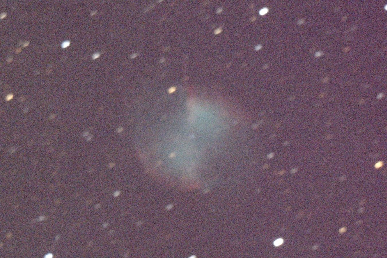 The Dumbbell Nebula, M27, a grey-green glow among stars